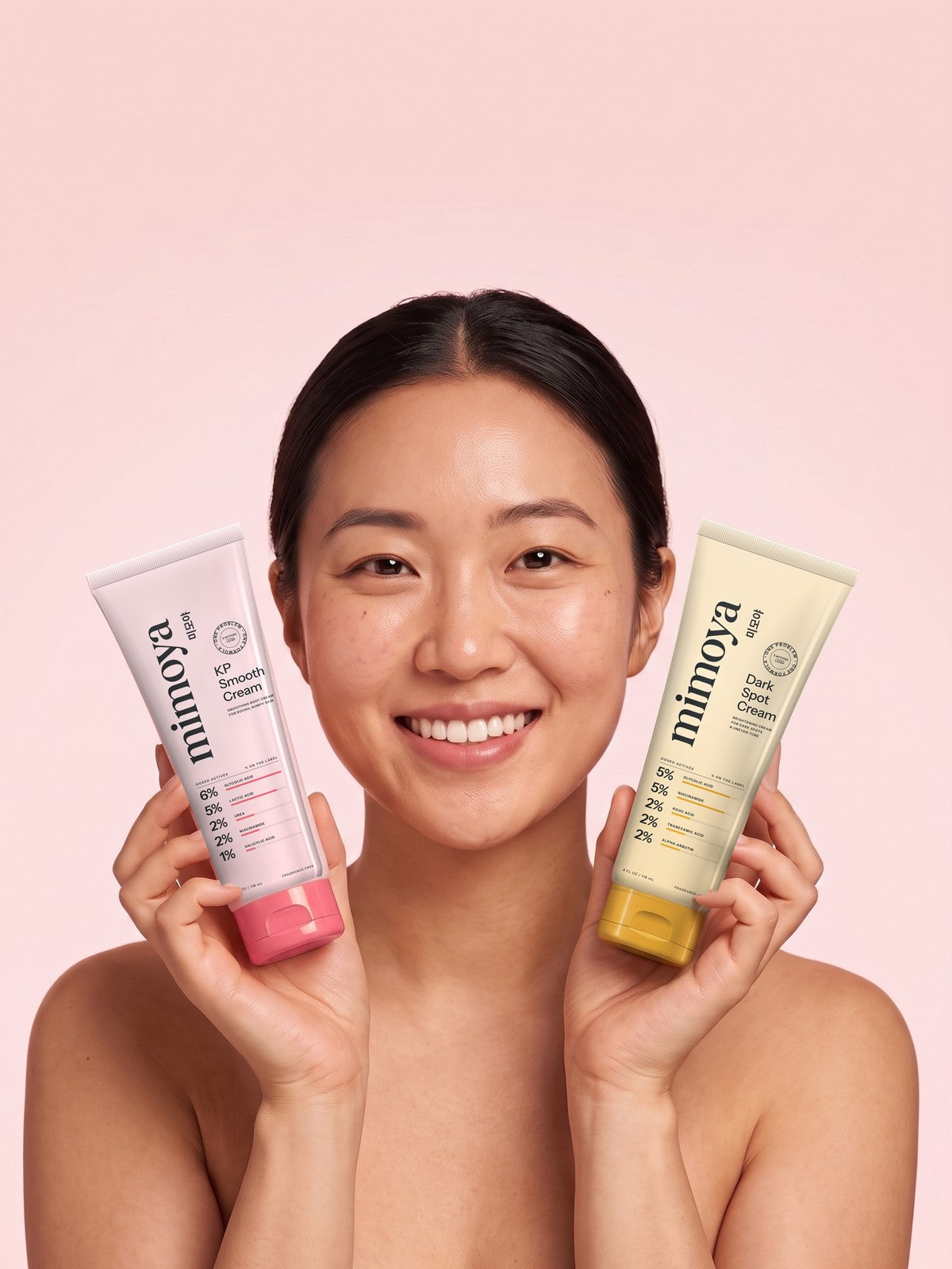 A woman holding the two MIMOYA tubes Image