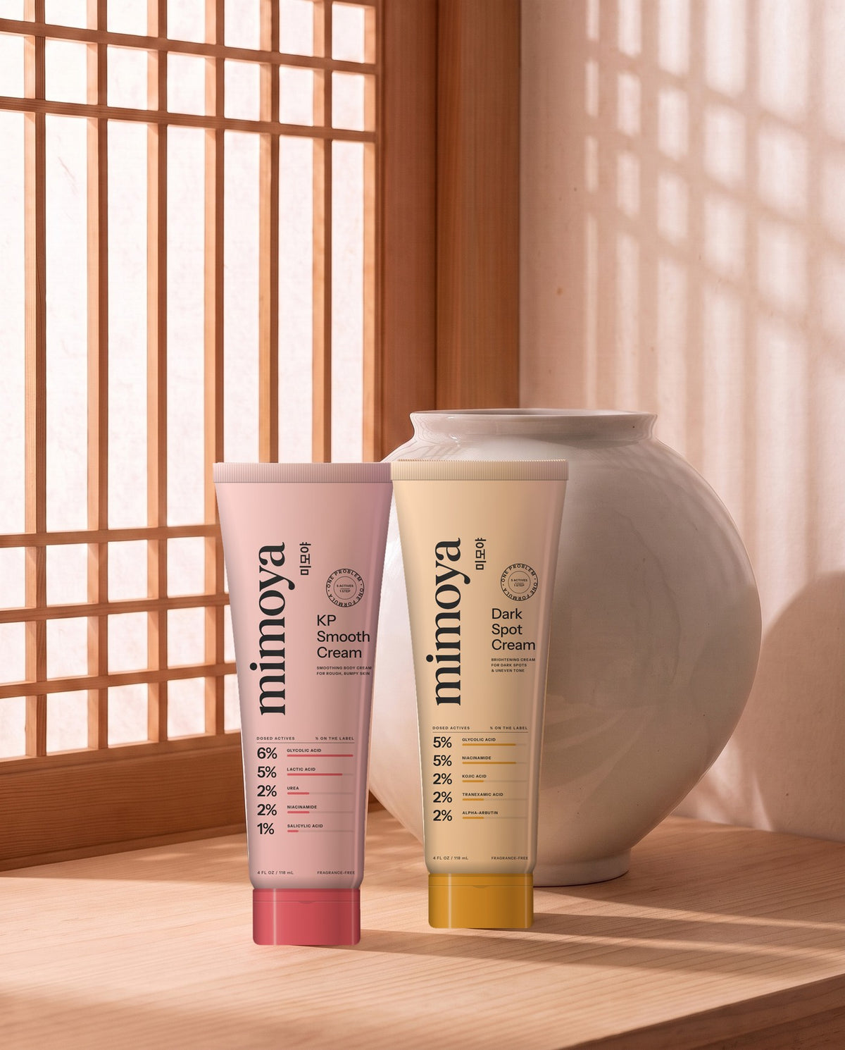 The two MIMOYA tubes beside a Korean moon jar in soft morning light Image
